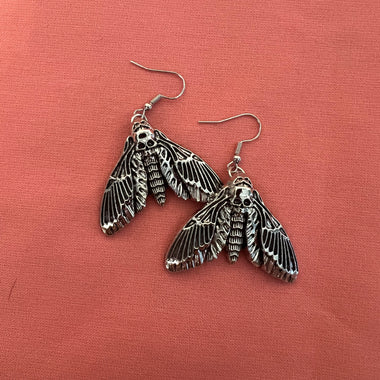 skull moth earrings