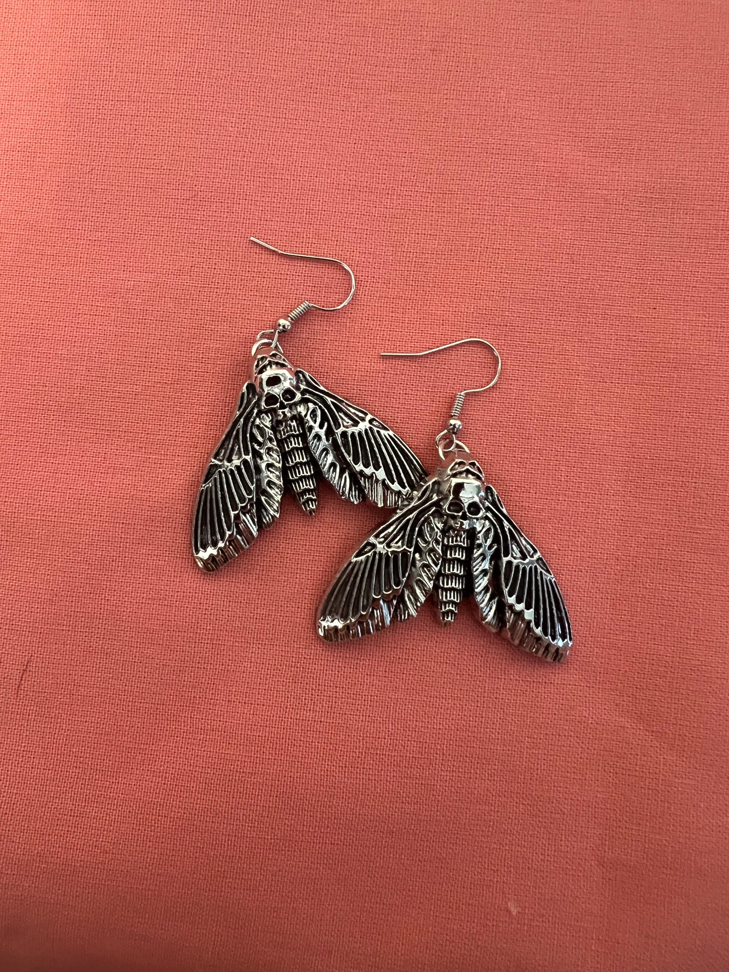 skull moth earrings